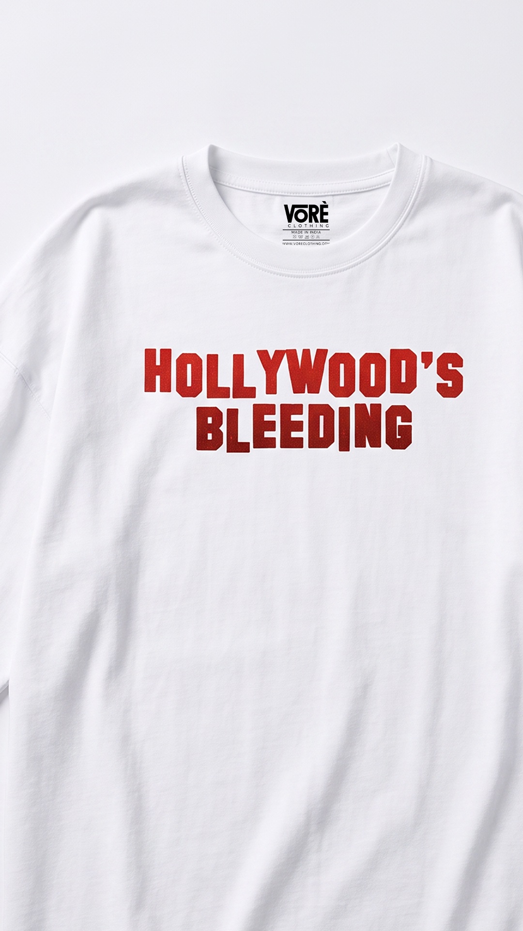 White VORÉ Hollywood’s Bleeding oversized tee with a red title print
